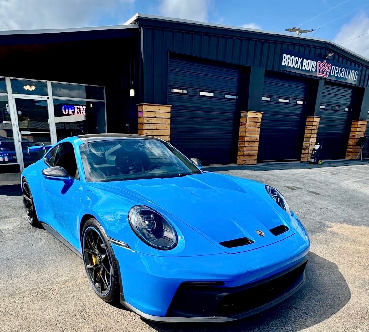 Blue Porsche 911 GT3 outside Brock Boys Detailing in Hot Springs